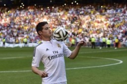 Colombian striker at his presentation at the Santiago Bernabeu stadium following his signing with Spanish club Real Madrid in Madrid on July 22, 2014. Spanish media said Real paid about €80 million ($108m) for Rodriguez, making him one of the most expensive players ever. Neither club gave a figure, but Monaco said it was "one of the biggest transfers in football history." ©AFP PHOTO / PIERRE-PHILIPPE MARCOU
