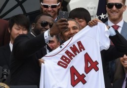 Red Sox Designated Hitter David Ortiz (L) takes a selfie with US President Barack Obama after presenting his a jersey during a ceremony on the South Lawn at the White House in Washington, DC, on April 1, 2014. ©AFP PHOTO/Jewel Samad