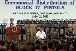 President Benigno S. Aquino III delivers his speech during the Ceremonial Distribution of brand new Glock 17 pistols to Philippine National Police (PNP) personnel at the PNP Multi-Purpose Center in Camp Crame, Quezon City on Tuesday (July 02, 2013). The new handguns form part of the 60,000 pistols purchased by the Philippine National Police through a P1.2-billion budget allocated through the PNP modernization program. According to a PNP advisory, around 600 individuals composed of officials of the Department of Interior and Local Government (DILG), PNP, and the National Police Commission will receive the Glock17 pistols. In photo are Interior and Local Government Secretary Manuel Roxas II and PNP Director General Alan Purisima. (MNS Photo).