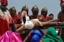 Ruben Enaje reacts after being nailed on the cross during the reenactment of the crucifixion of Jesus Christ in Cutud, Pampanga on Good Friday. Eñaje is one of several penitents who have themselves nailed on the cross. (MNS photo)