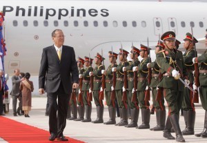 Aquino defends overseas trips