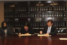 Deputy Consul General Imelda Panolong with Consul General Maria Hellen M. Barber-De La Vega and Acting Regional Administrator Mr. Eric Harbin signing the partnership Alliance.