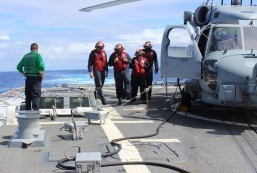 INDIAN OCEAN (March 16, 2014): Sailors inspect the flight deck of the Arleigh Burke-class destroyer USS Kidd (DDG 100). Kidd is conducting search and rescue operations in the Indian Ocean for the missing Malaysian Airlines flight MH370. U.S. Navy photo (Released) 140316-N-ZZ999-002