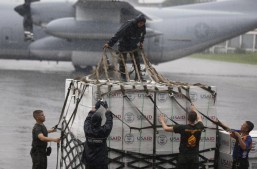 A U.S. Marine uses cargo nets to secure a load of palletized equipment on a KC-130J Hercules aircraft at Marine Corps Air Station Futenma, Okinawa, Japan, during preparation for a humanitarian assistance and disaster relief mission to the Philippines in the wake of Typhoon Haiyan, Nov. 11, 2013. The Marines are assigned to the 3rd Expeditionary Force. U.S. Marine Corps photo by Lance Cpl. David N. Hersey