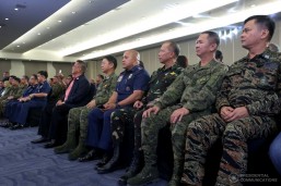 Armed Forces of the Philippines Chief of Staff Lt. Gen. Eduardo Año, Philippine National Police Director General Ronald Dela Rosa, Philippine Air Force Commander Lt. Gen. Edgar Fallorina, Philippine Army Chief Lt. Gen. Glorioso Miranda, and Philippine Navy Commander Vice Admiral Ronald Mercado listen as President Rodrigo Roa Duterte delivers his message during a meeting with local chief executives in Mindanao at the SMX Convention Center in Davao City on March 9, 2017. (MNS photo)