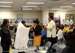 Fr. Albert Avenido receiving the offertory delivered by Consul General De La Vega and Mr.Joveno De La Vega.