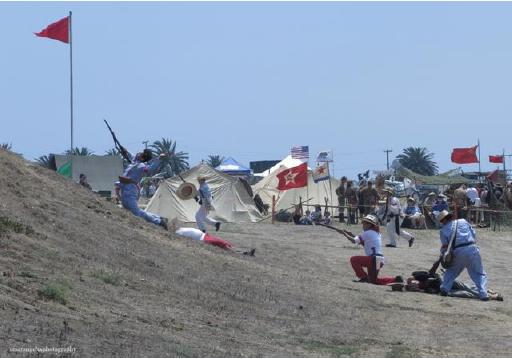 Photo above shows members of the Philippine Scouts Heritage re-enacting Filipino assaults in the Philippine-American War.