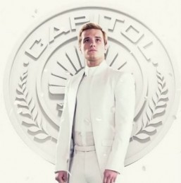 After winning the last Hunger Games, Peeta is forced to lend his image to President Snow's propaganda campaign in "Mockingjay: Part 1." ©http://capitolcouture.pn/home