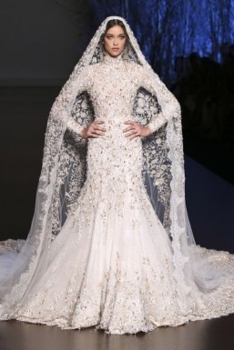 Ralph & Russo - Haute Couture - fall/winter 2015-2016 Though more traditional, Ralph & Russo's gown is no less impressive, if only because of the amazing work done on the embroidery. Embroidered with pearls, the gown is worn with a very long train. A real fairytale wedding gown. ©Ralph & Russo