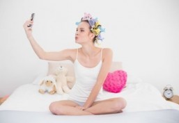 SelfiePolice targets selfie takers, ‘fining’ them $1 per photo and donating the money to charity. ©lightwavemedia/shutterstock.com