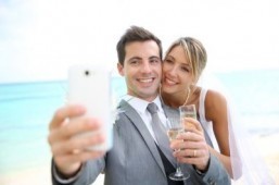 No need to take any more "shameless selfies." A social media wedding concierge will take Instagram photos and live-tweet your wedding for a paltry $3,000. ©goodluz/shutterstock.com